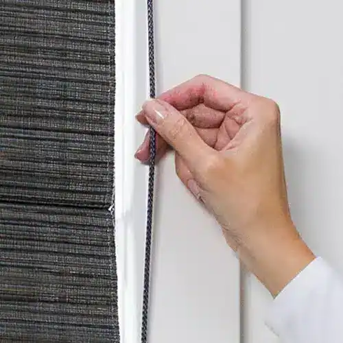 High-quality black roller blinds with manual adjustment mechanism for windows. Perfect for controlling light and enhancing privacy in your home or office. Superior Blinds offers custom window treatments.