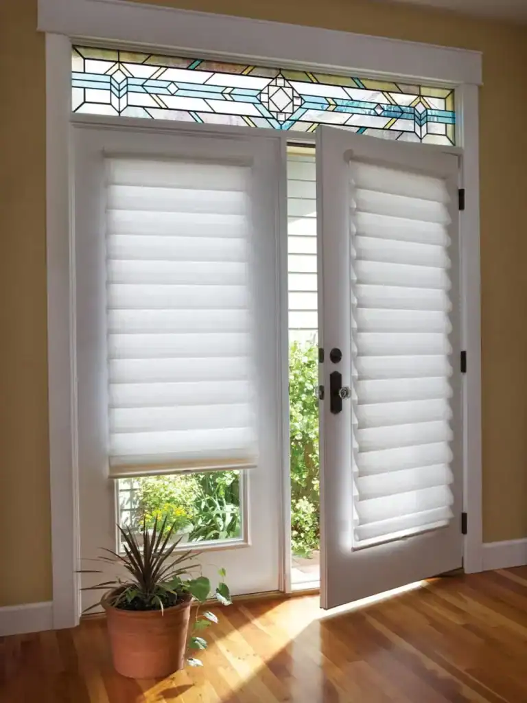Custom white Roman shades with a stained glass transom window, enhancing natural light and privacy in a stylish home entryway. Perfect for modern or traditional decor.