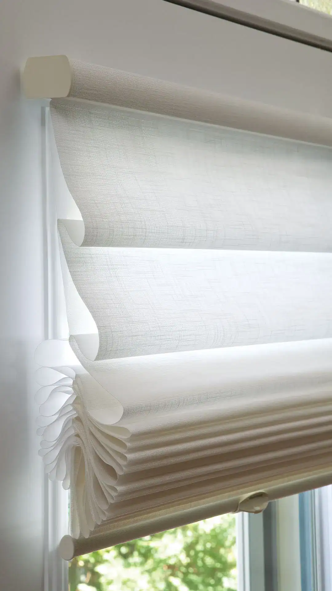 Luxurious white roller window shades for modern home decor, offering light control and privacy, perfect for residential or commercial spaces.
