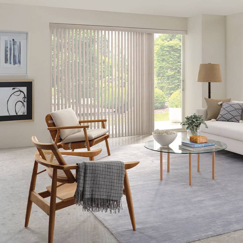Vertical beige blinds on large window in modern living room, natural light, minimalist decor, Superior Blinds style, clean and elegant window treatment, neutral color palette.
