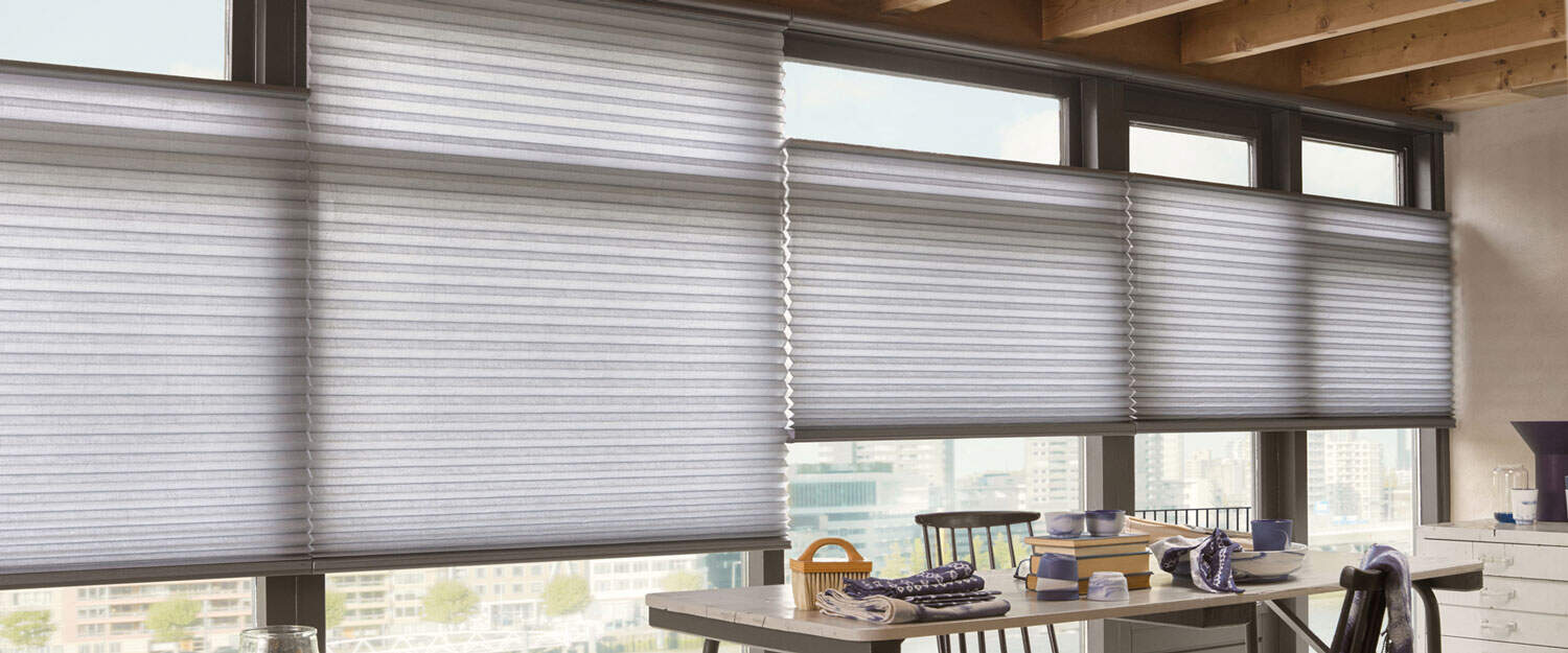 Darkening white cellular window blinds for energy efficiency and privacy. Perfect for modern homes and offices seeking stylish, functional light control solutions.