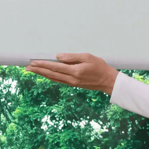 Light-filtering window blinds being installed, showcasing superior blinds for home and office window covering solutions.