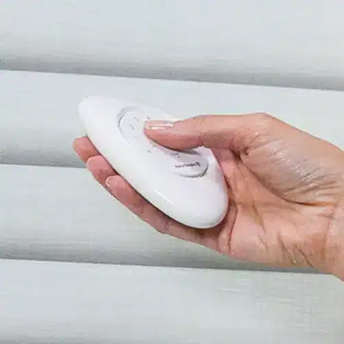 Remotely control window blinds with a sleek, modern remote for improved convenience and home automation.